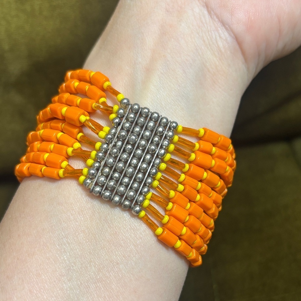 Orange barrel and seed bead multi strand stretch bracelet